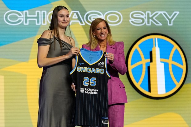 Ajsa Sivka, left, poses for a photo with WNBA commissioner Cathy Engelbert after being selected 10th overall by the Chicago Sky during the first round of the WNBA basketball draft, Monday, April 14, 2025, in New York. (AP Photo/Pamela Smith)