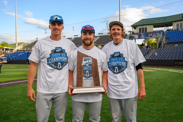 Chris Brown, Colby Brouillette and Wyatt Cameron (left to right) with the NEC championship trophy. (CCSU athletics)