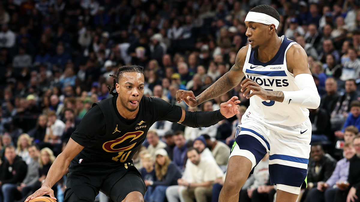 Cleveland Cavaliers guard Darius Garland (10) works around Minnesota Timberwolves forward Jaden McDaniels (3) during the third quarter at Target Center.