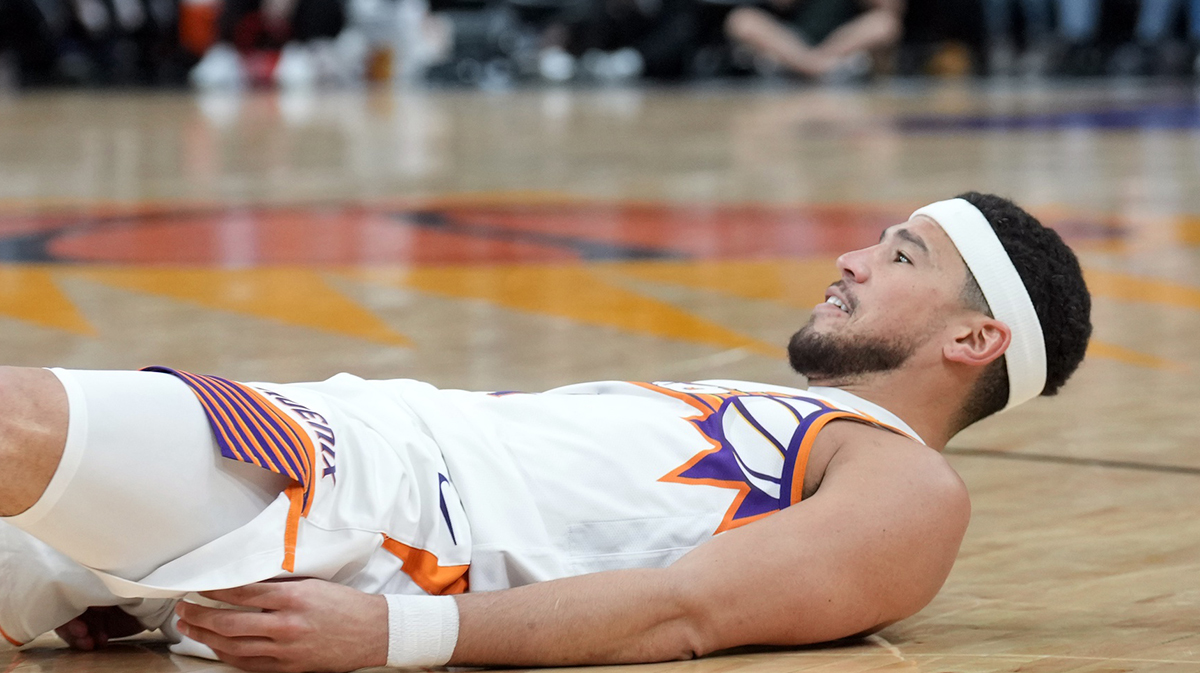 Phoenix Suns guard Devin Booker (1) reacts after making a basket and being fouled against the San Antonio Spurs during the second half at Footprint Center. 