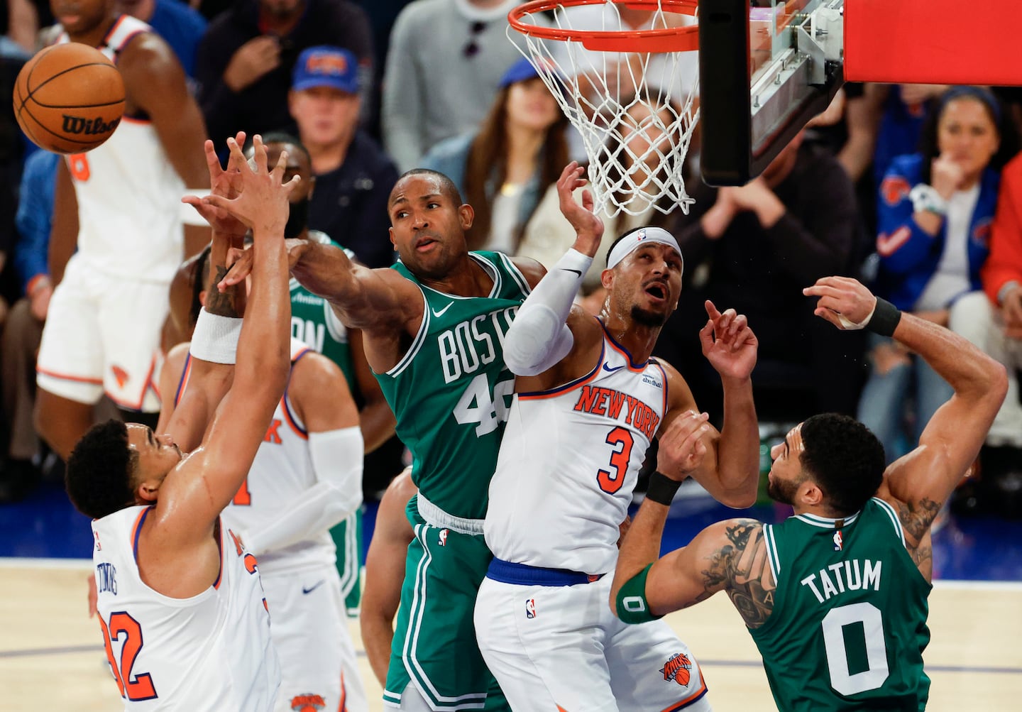 Boston Celtics forward Al Horford (middle left) fights for possession near New York Knicks guard Josh Hart (3) during the second quarter.