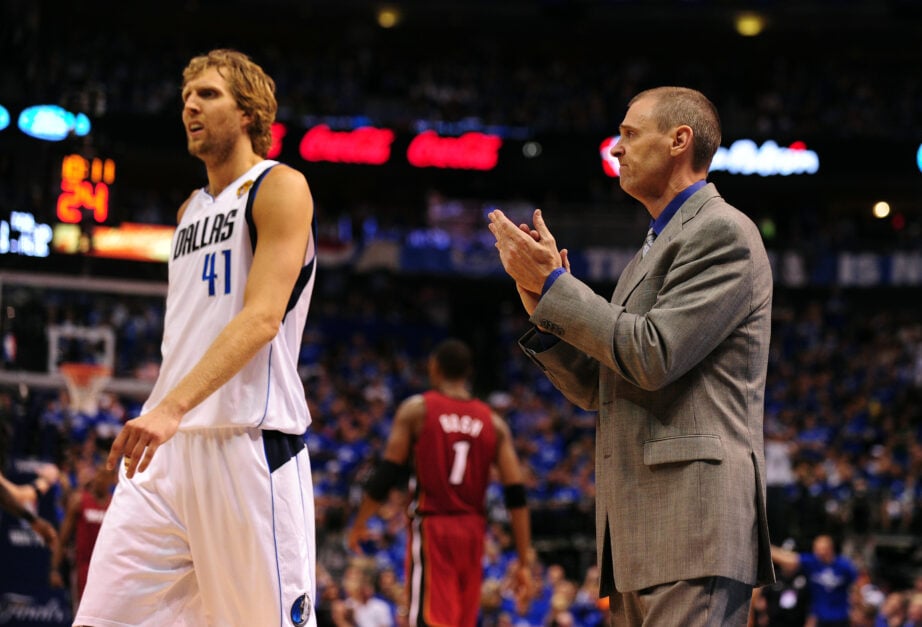 Dallas Mavericks head coach Rick Carlisle applauds while Dirk Nowitzki (L) walks off the court during game 4 of the 2011 NBA Finals.
