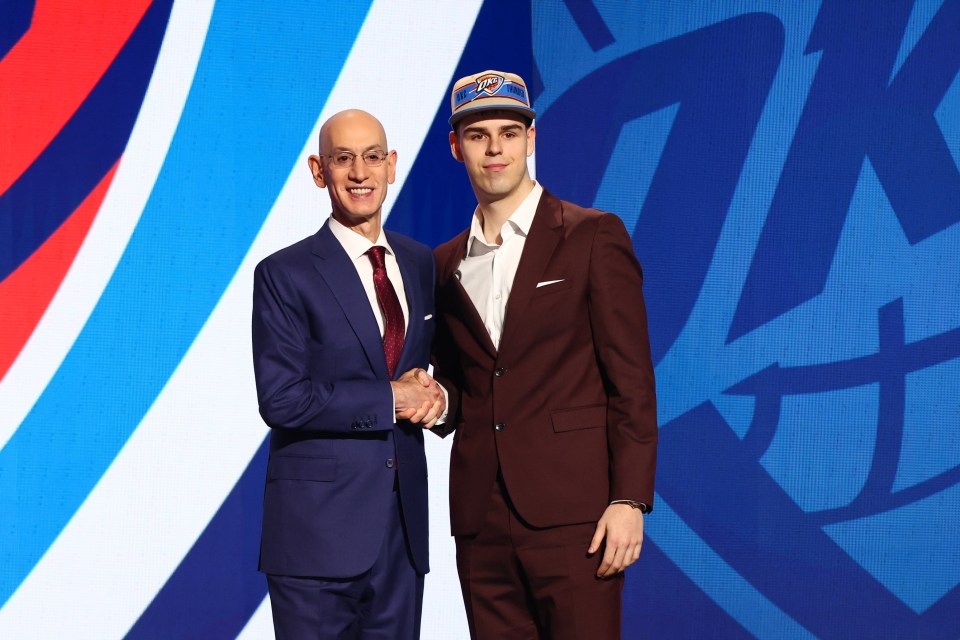 NEW YORK, NEW YORK - JUNE 26: Nikola Topic (R) shakes hands with NBA commissioner Adam Silver (L) after being drafted 12th overall by the Oklahoma City Thunder during the first round of the 2024 NBA Draft at Barclays Center on June 26, 2024 in the Brooklyn borough of New York City. NOTE TO USER: User expressly acknowledges and agrees that, by downloading and or using this photograph, User is consenting to the terms and conditions of the Getty Images License Agreement. (Photo by Sarah Stier/Getty Images)