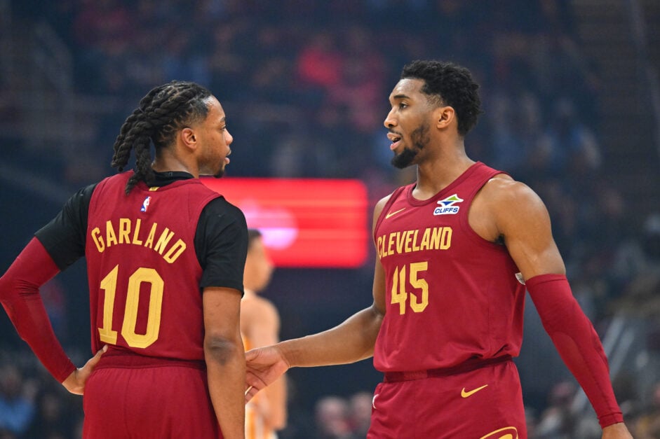 Darius Garland #10 talks with Donovan Mitchell #45 of the Cleveland Cavaliers during the first quarter against the Atlanta Hawks at Rocket Mortgage Fieldhouse on January 30, 2025 in Cleveland, Ohio.