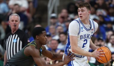 Cooper Flagg #2 of the Duke Blue Devils is defended by VJ Edgecombe #7 of the Baylor Bears
