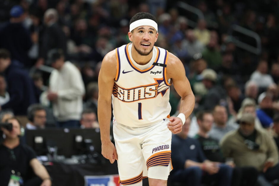 Devin Booker #1 of the Phoenix Suns waits for a free throw during a game against the Milwaukee Bucks at Fiserv Forum.