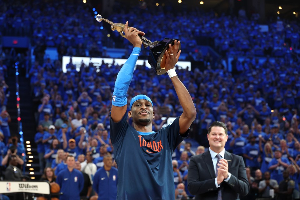 OKLAHOMA CITY, OKLAHOMA - MAY 22: Shai Gilgeous-Alexander #2 of the Oklahoma City Thunder accepts the MVP Michael Jordan Trophy prior to a game against the Minnesota Timberwolves in Game Two of the Western Conference Finals of the 2025 NBA Playoffs at Paycom Center on May 22, 2025 in Oklahoma City, Oklahoma. NOTE TO USER: User expressly acknowledges and agrees that, by downloading and or using this photograph, User is consenting to the terms and conditions of the Getty Images License Agreement. (Photo by Matthew Stockman/Getty Images)