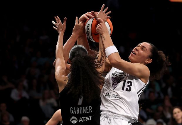 NEW YORK, NEW YORK - MAY 29: Janelle Salaun #13 of the Golden State Valkyries fight for the rebound with Rebekah Gardner #7 of the New York Liberty in the first half at Barclays Center on May 29, 2025 in the Brooklyn borough of New York City. NOTE TO USER: User expressly acknowledges and agrees that, by downloading and or using this photograph, User is consenting to the terms and conditions of the Getty Images License Agreement. (Photo by Elsa/Getty Images)