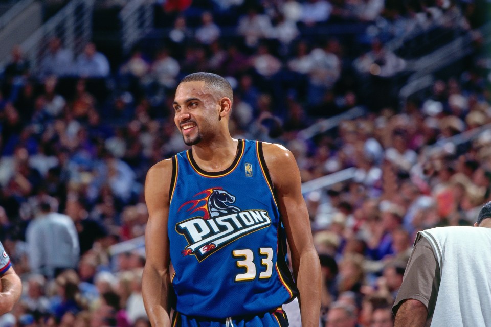 PHOENIX - 1997: Grant Hill #4 of the Detroit Pistons smiles circa 1997 at America West Arena in Phoenix, Arizona. NOTE TO USER: User expressly acknowledges and agrees that, by downloading and or using this photograph, User is consenting to the terms and conditions of the Getty Images License Agreement. Mandatory Copyright Notice: Copyright 1997 NBAE (Photo by Sam Forencich/NBAE via Getty Images)