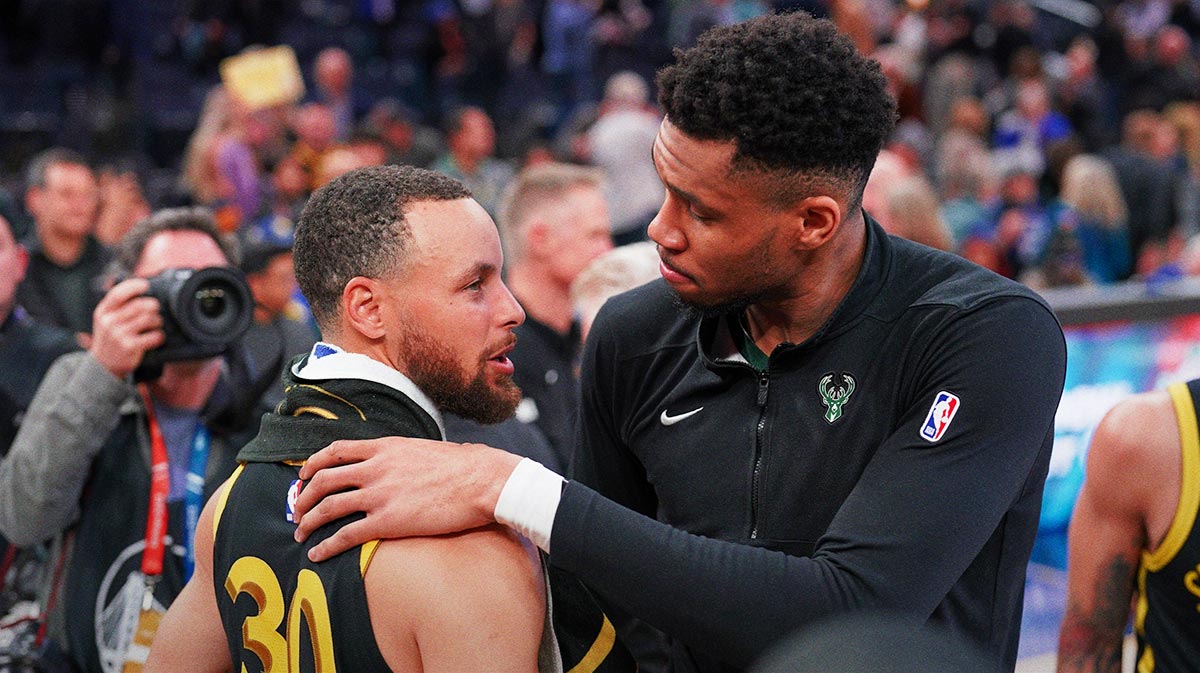 Milwaukee Bucks forward Giannis Antetokounmpo (34) and Golden State Warriors guard Stephen Curry (30) meet after the game at the Chase Center.