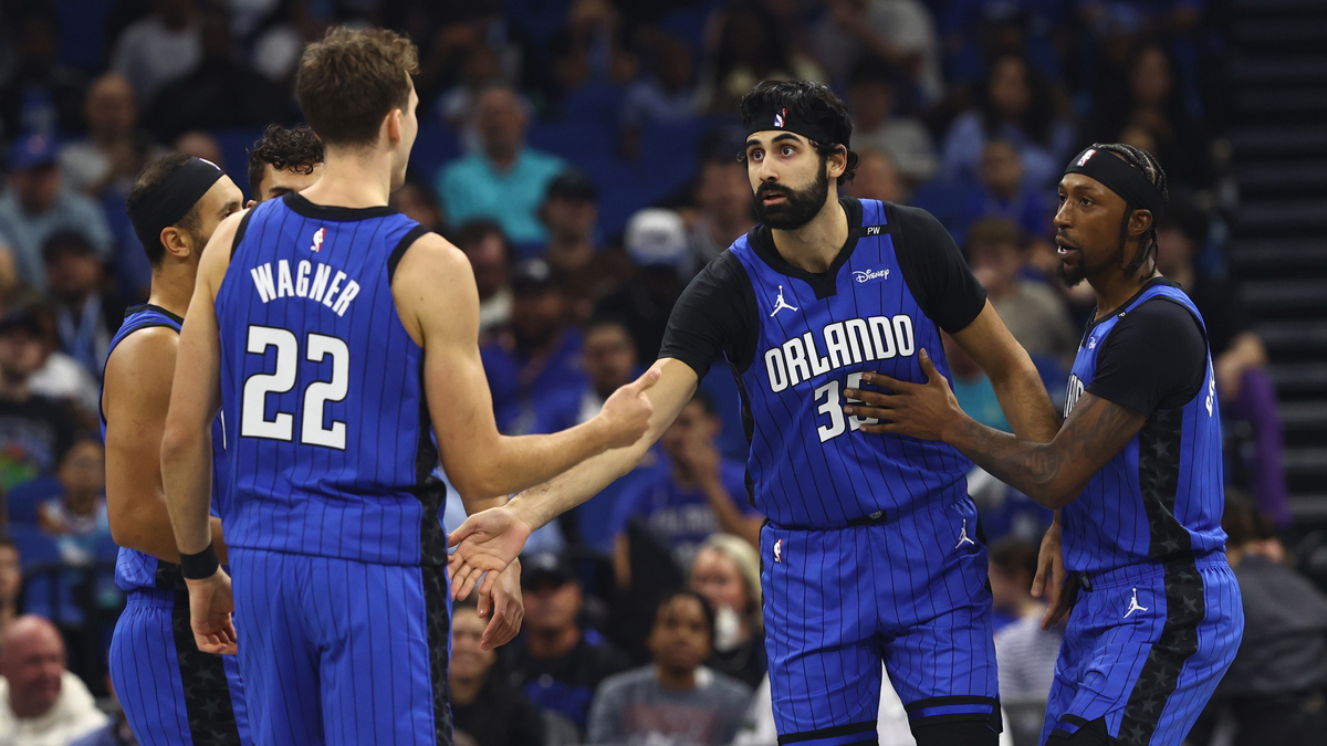 Orlando Magic center Goga Bitadze (35) is congratulated by forward Franz Wagner (22)and teammates against the Charlotte Hornets during the first quarter at Kia Center.