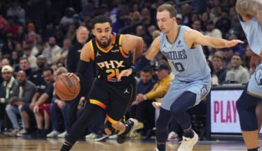 Phoenix Suns guard Tyus Jones (21) drives on Memphis Grizzlies guard Luke Kennard during the first ...