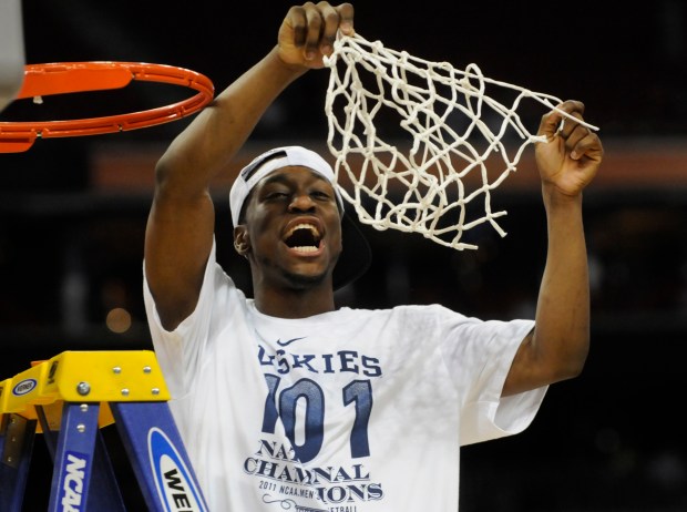 UConn's Kemba Walker celebrates a 2011 national championship win over Butler at Reliant Stadium in Houston. Walker's magical postseason run through that season propelled the Huskies to a third national title and elevated Walker into becoming an NBA lottery pick. (Courant file photo) 