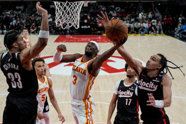 Hawks guard Caris LeVert (3) goes to the basket against the Portland Trail Blazers on April 1 in Atlanta. The Hawks currently have two first-round picks in next month’s NBA draft, one of which is a lower-level lottery pick. (Mike Stewart/AP)