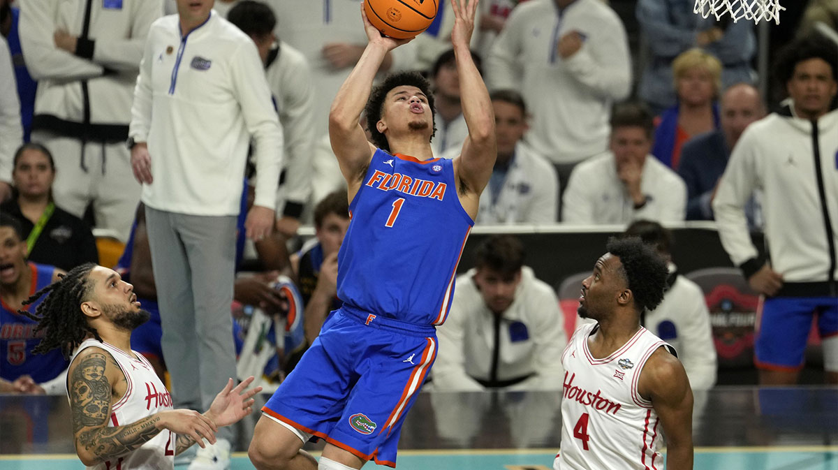 Florida Gators guard Walter Clayton Jr. (1) shoots the ball against Houston Cougars guard L.J. Cryer (4) during the second half in the national championship game of the Final Four of the 2025 NCAA Tournament at the Alamodome.