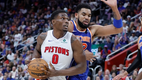 Detroit Pistons center Jalen Duren (0) is guarded by New York Knicks center Karl-Anthony Towns (32) while going to the basket during the second half of Game 4 of an NBA basketball first-round playoff series Sunday, April 27, 2025, in Detroit.