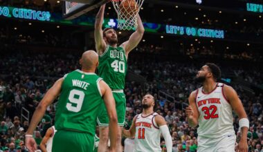 Boston Celtics center Luke Kornet (40) dunks off a pass from Boston Celtics guard Derrick White (9) during the second quarter.