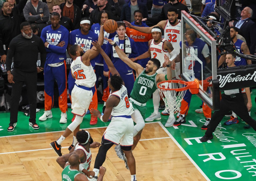 Jayson Tatum turns the ball over to Mikal Bridges (left) in the closing seconds of the Knicks' Game 2 comeback win over the Celtics.