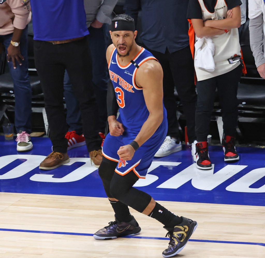 Josh Hart celebrates after Malik Beasley loses the ball on the final Pistons' possession during the Knicks' Game 6 series-clinching win over the Pistons.