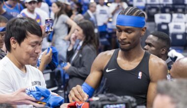 Oklahoma City Thunder guard Shai Gilgeous-Alexander signs his autograph for fans before game five of the western conference finals against the Minnesota Timberwolves for the 2025 NBA Playoffs at Paycom Center.
