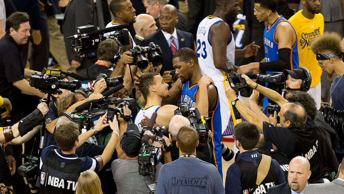 Golden State Warriors guard Stephen Curry (30) and Oklahoma City Thunder forward Kevin Durant (35) meet after game seven of the Western conference finals of the NBA Playoffs at Oracle Arena. The Golden State Warriors defeated the Oklahoma City Thunder 96-88.