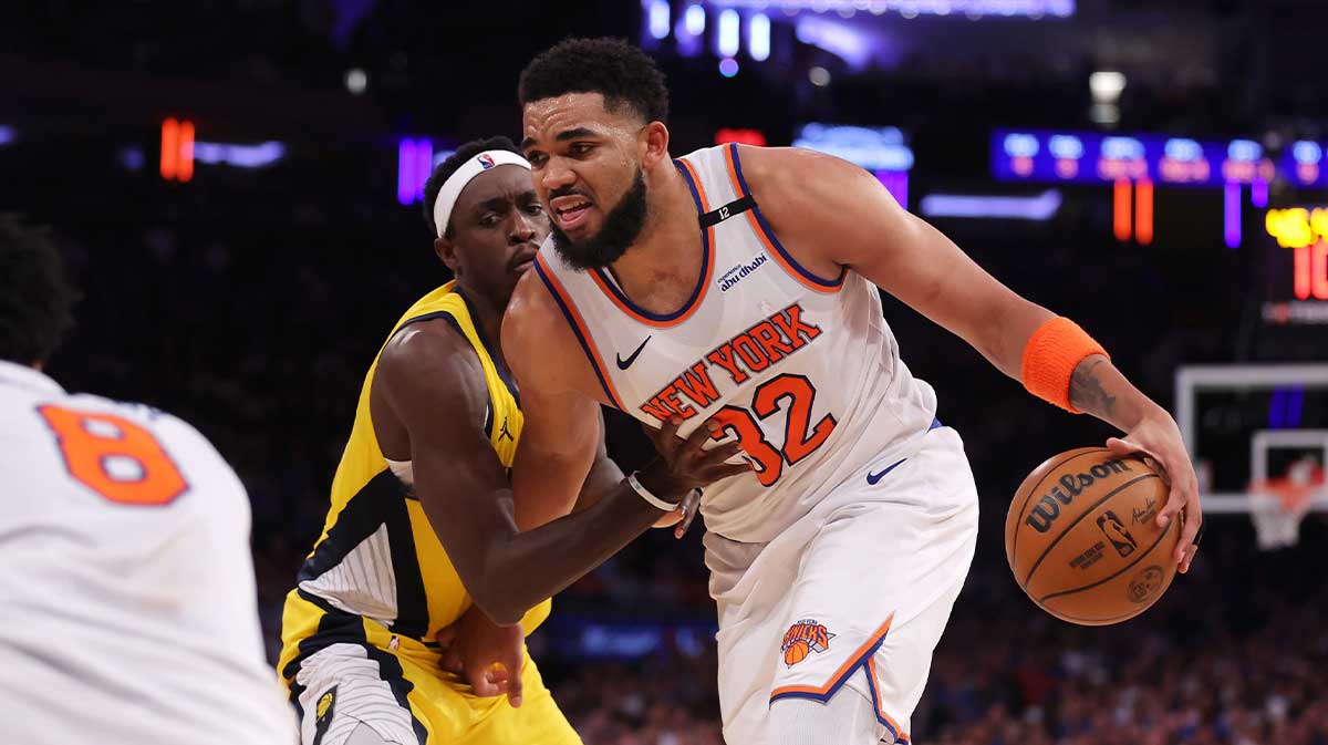 New York Knicks center Karl-Anthony Towns (32) controls the ball against Indiana Pacers forward Pascal Siakam (43) in the third quarter during game one of the eastern conference finals for the 2025 NBA Playoffs at Madison Square Garden. 