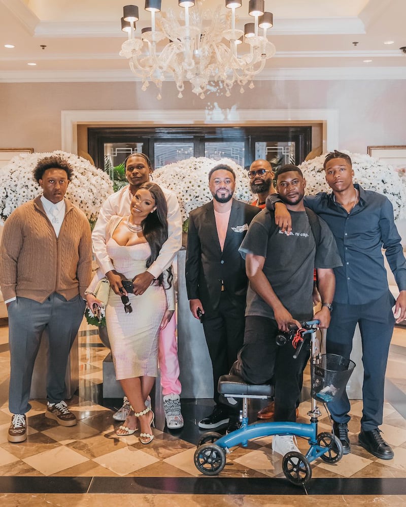 Edwards (second from left) is shown with his inner circle of Nick Maddox, girlfriend Shannon Jackson, Justin Holland, his uncle Drew, Tre McCain and (Antony) Bubba Edwards.