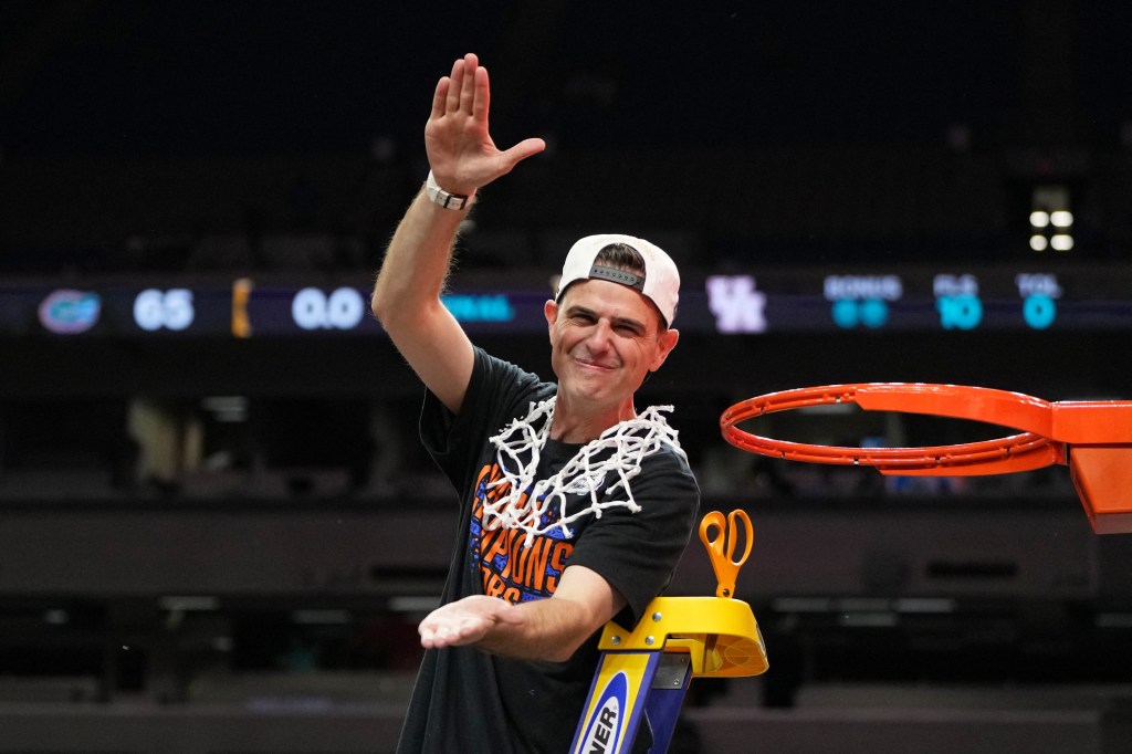 Florida Gators head coach Todd Golden reacts after cutting down a piece of the net after winning the national championship game of the Final Four of the 2025 NCAA Tournament at the Alamodome.