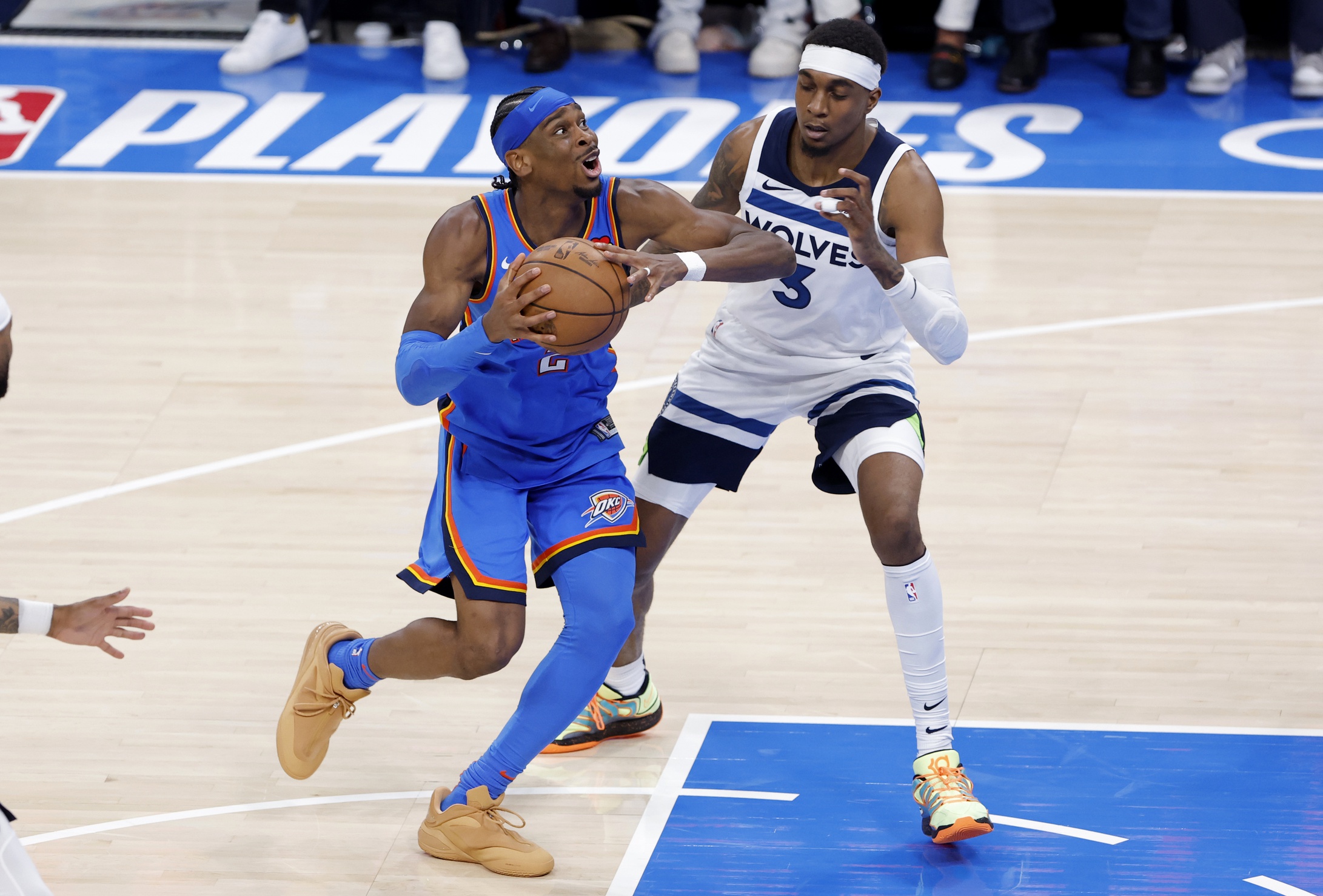 Oklahoma City Thunder guard Shai Gilgeous-Alexander (2) drives against Minnesota Timberwolves forward Jaden McDaniels (3) in the fourth quarter during game two of the western conference finals for the 2025 NBA Playoffs at Paycom Center.