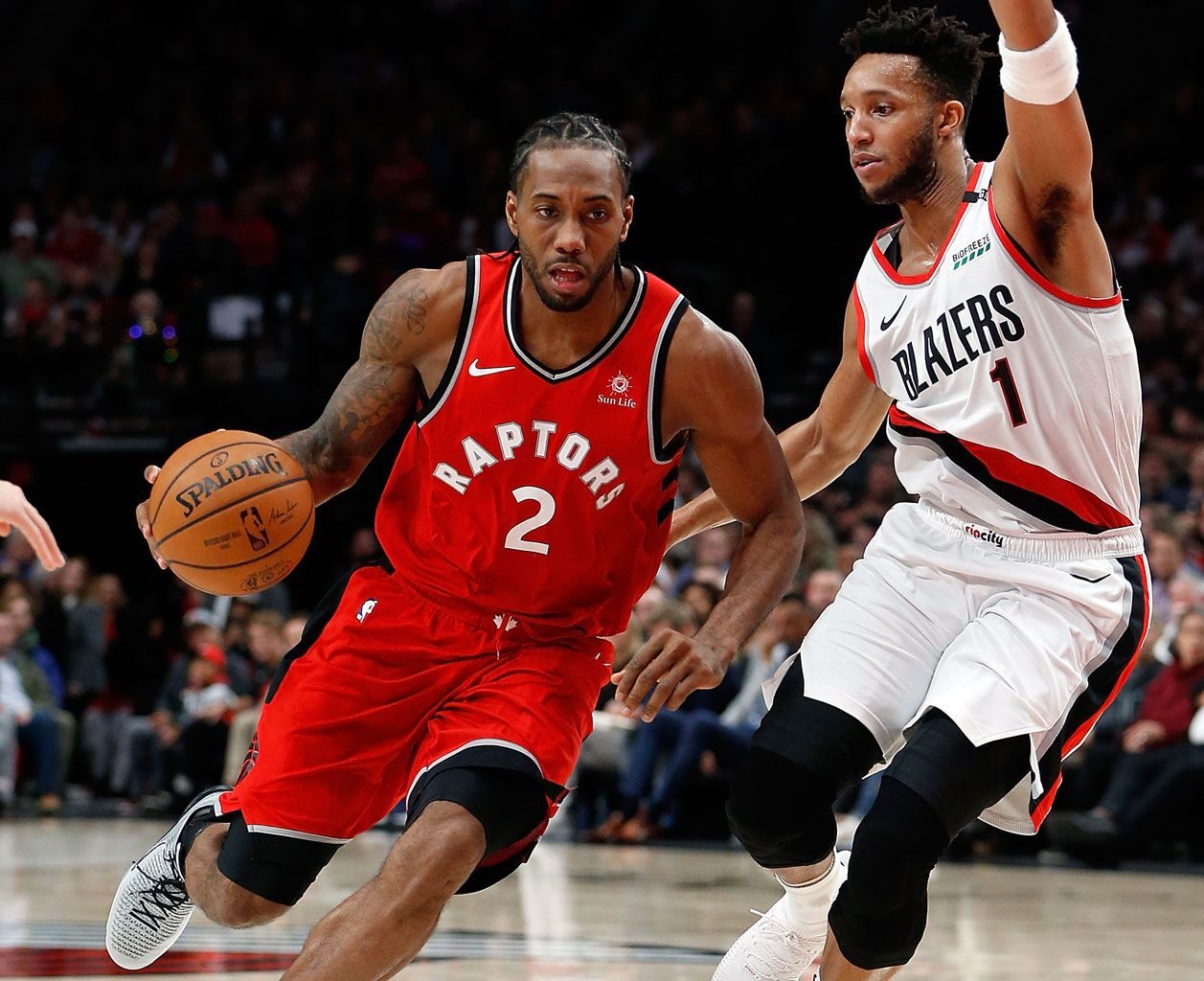 Kawhi Leonard driving against Evan Turner