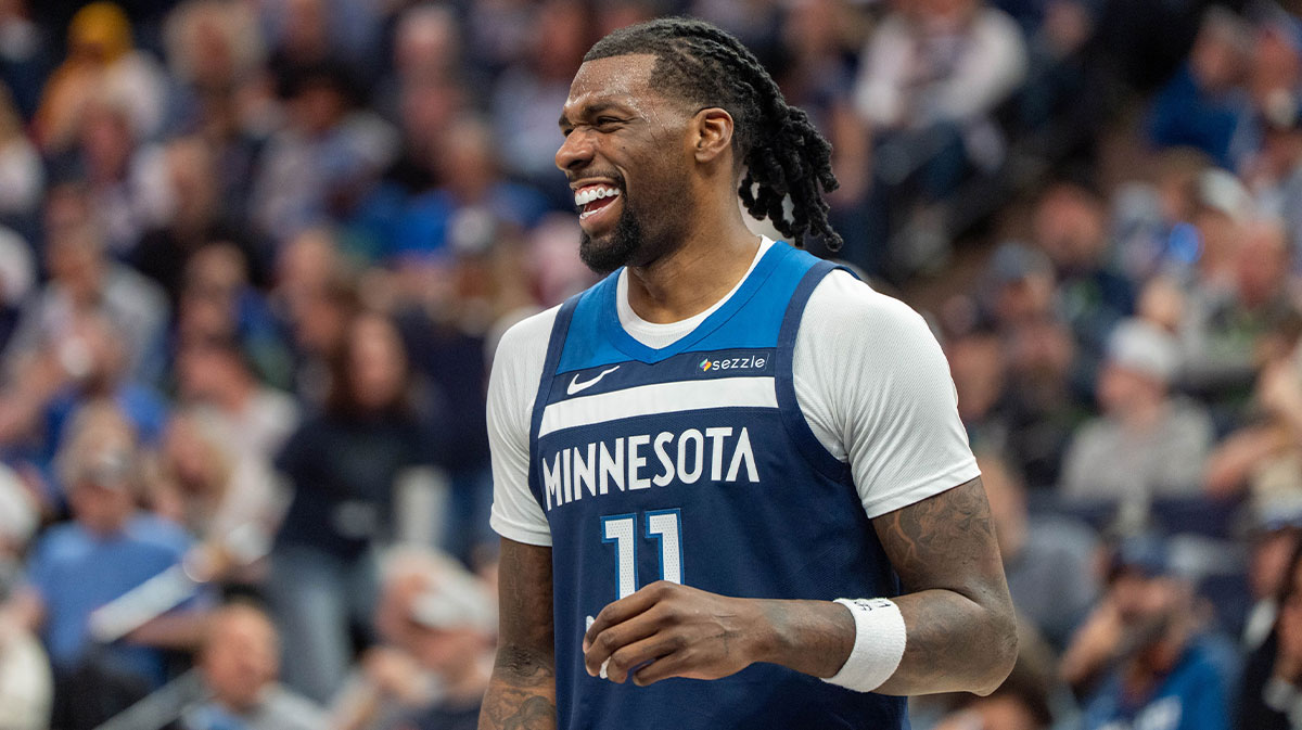 Minnesota Timberwolves center Naz Reid (11) laughs with a teammate during a stoppage in the fourth quarter against the Utah Jazz at Target Center.