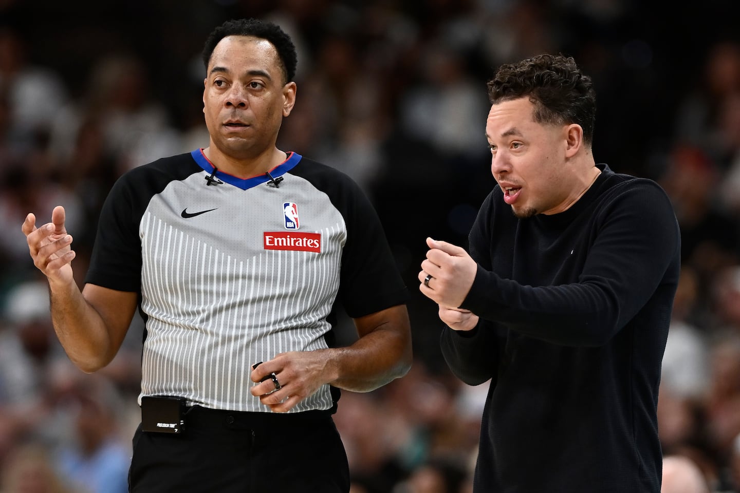 After serving as the Spurs acting coach for 77 games this season, Mitch Johnson (right) was officially announced as the team's coach on Monday.