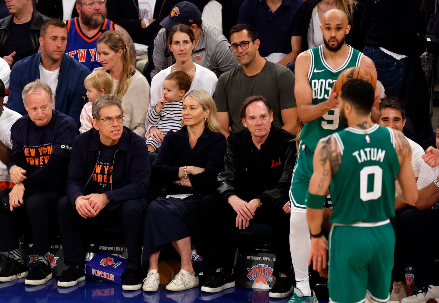Actor Ben Stiller (second from left) appears to talk to Boston Celtics forward Jayson Tatum (0) and guard Derrick White (9) while the New York Knicks are down during the second quarter.