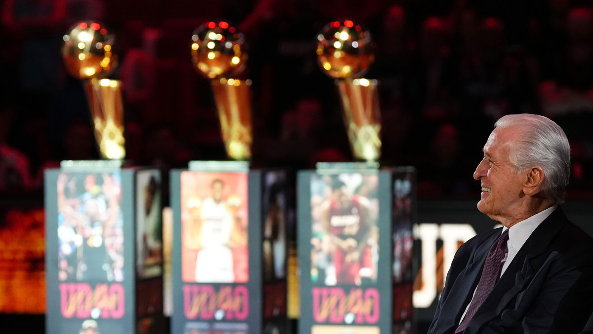 Miami Heat president Pat Riley sits on the court for the jersey retirement ceremony for former player Udonis Haslem during halftime of the game between the Miami Heat and the Atlanta Hawks Kaseya Center