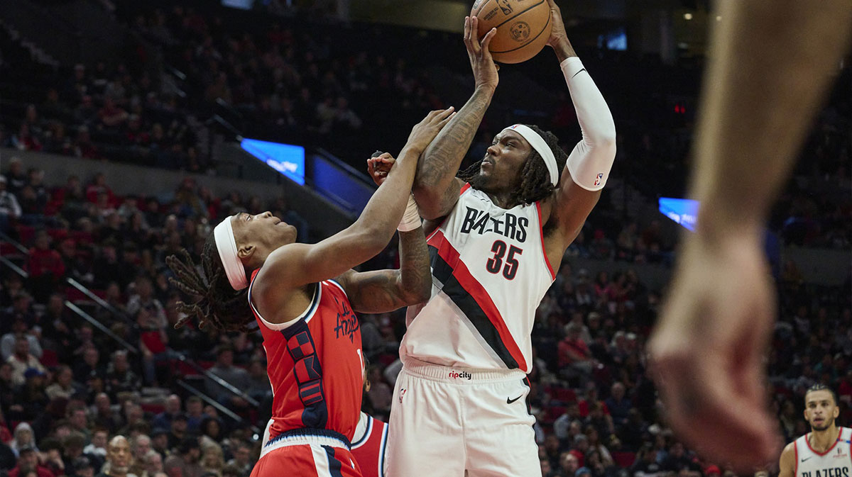 Portland Trail Blazers center Robert Williams III (35) grabs a rebound during the second half against LA Clippers guard Terance Mann (14) at Moda Center.