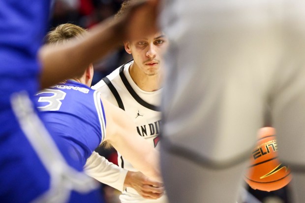 San Diego State guard Miles Byrd looks to pass against Air Force forward Luke Kearney during their game at Viejas Arena on Wednesday, Jan. 8, 2025 in San Diego, CA. (Meg McLaughlin / The San Diego Union-Tribune)