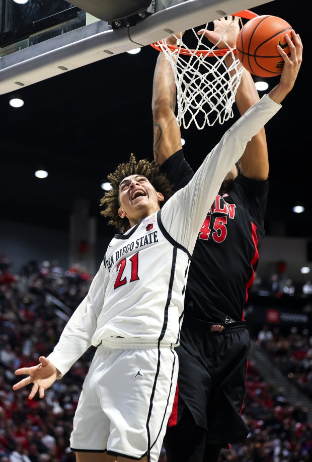 San Diego State guard Miles Byrd goes up for a shot against UNLV forward Jeremiah Cherry during their game at Viejas Arena on Saturday, Jan. 18, 2025 in San Diego, CA. (Meg McLaughlin / The San Diego Union-Tribune)