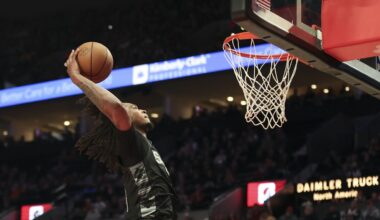 San Antonio Spurs guard Stephon Castle (5) dunks against the Portland Trail Blazers during the second half of an NBA basketball game Sunday, April 6, 2025, in Portland, Ore. (AP Photo/Amanda Loman)