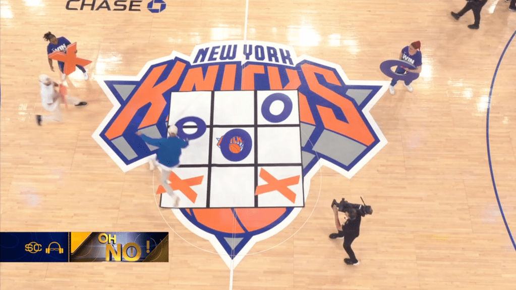 In a game of tic-tac-toe at the Garden, one fan opted not to play defense and handed victory to his opponent.
