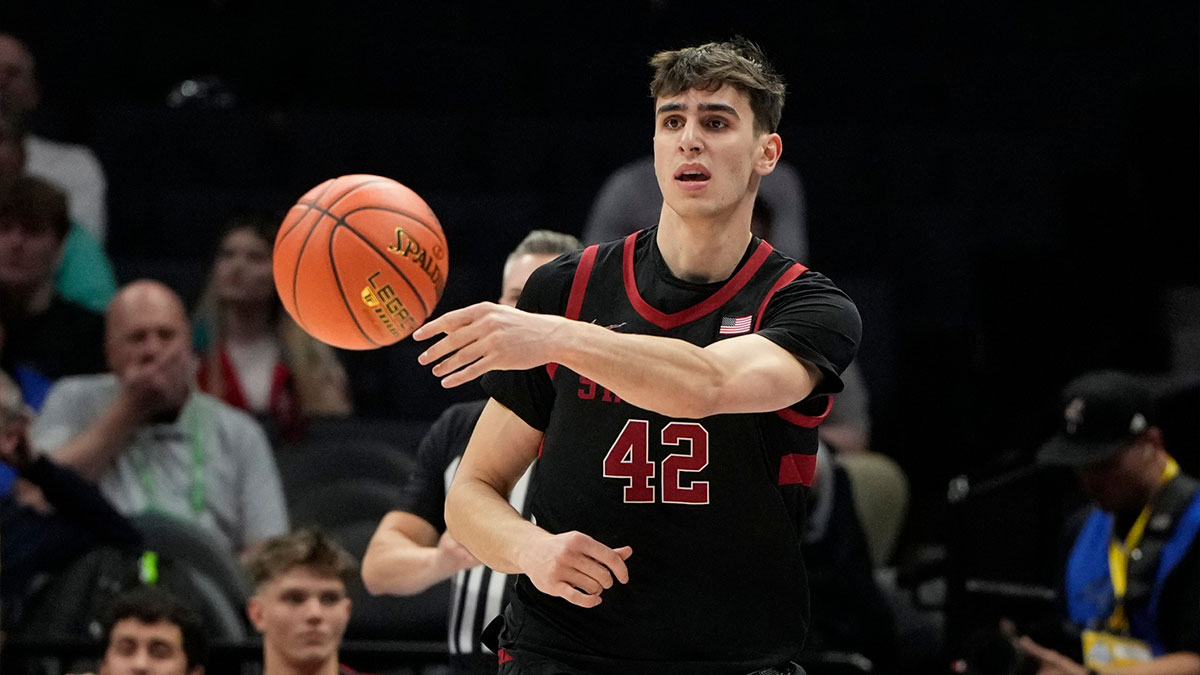 Stanford Cardinal forward Maxime Raynaud (42) passes the ball in the first half at Spectrum Center