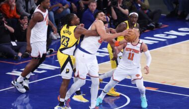 New York Knicks center Karl-Anthony Towns (32) and Indiana Pacers forward Aaron Nesmith (23) fight for the rebound in the third quarter during game two of the eastern conference finals for the 2025 NBA Playoffs at Madison Square Garden.