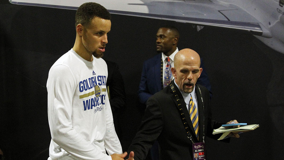 Golden State Warriors guard Stephen Curry (30) leaves the press conference with vice president of communications Raymond Ridder following the 93-89 loss against the Cleveland Cavaliers iin game seven of the NBA Finals at Oracle Arena. 