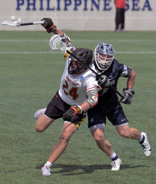 Maryland Terrapins midfielder Bryce Ford keeps possession as Georgetown Hoyas...