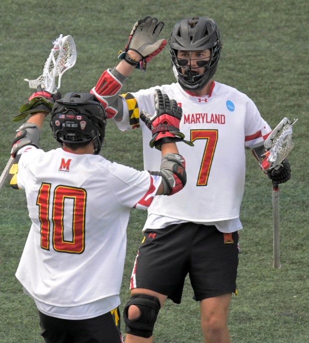 Scoring against the Georgetown Hoyas, Maryland Terrapins attack Eric Spanos...