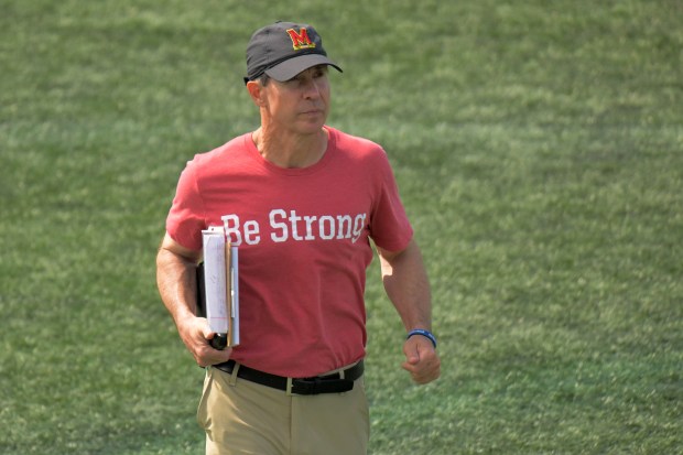 Maryland Terrapins men's lacrosse head coach John Tillman jogs during...