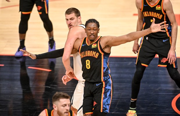 Nikola Jokic (15) of the Denver Nuggets tangles with Jalen...