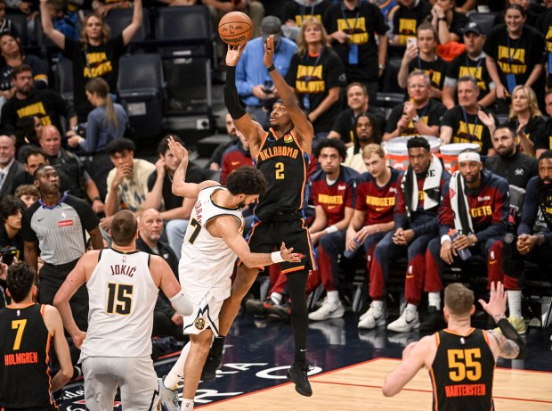 Shai Gilgeous-Alexander (2) of the Oklahoma City Thunder scores over...