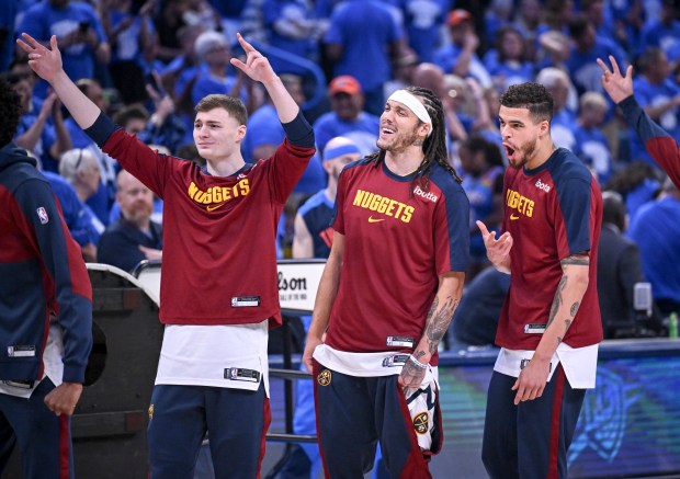 Christian Braun (0), Aaron Gordon (32) and Michael Porter Jr. (1) of the Denver Nuggets react after DeAndre Jordan (6) hit a 3-pointer in warmups before the first quarter against the Oklahoma City Thunder at Paycom Center in Oklahoma City on Sunday, May 18, 2025. (Photo by AAron Ontiveroz/The Denver Post)