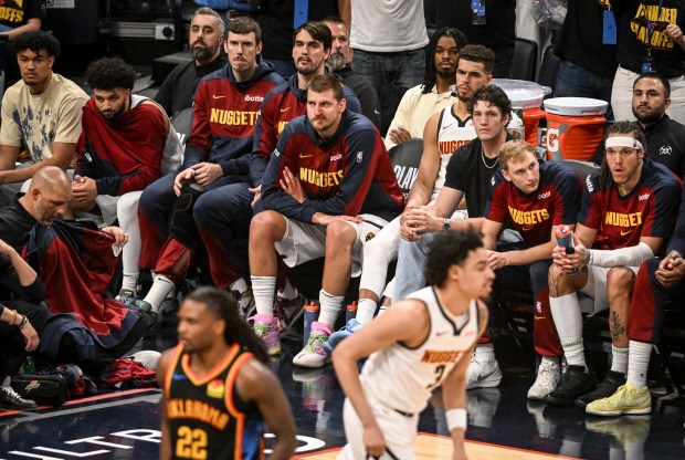 Nikola Jokic (15) of the Denver Nuggets sits on the...