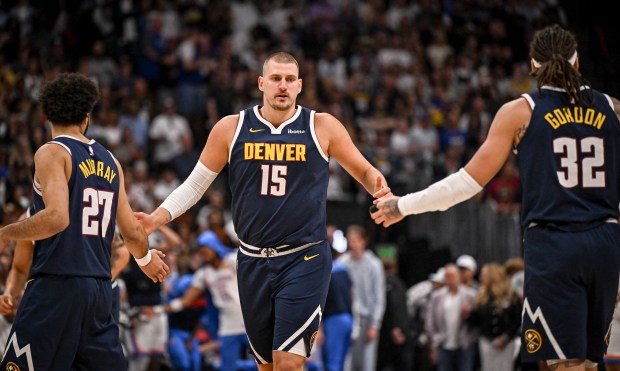 Nikola Jokic (15) of the Denver Nuggets prepares to low...